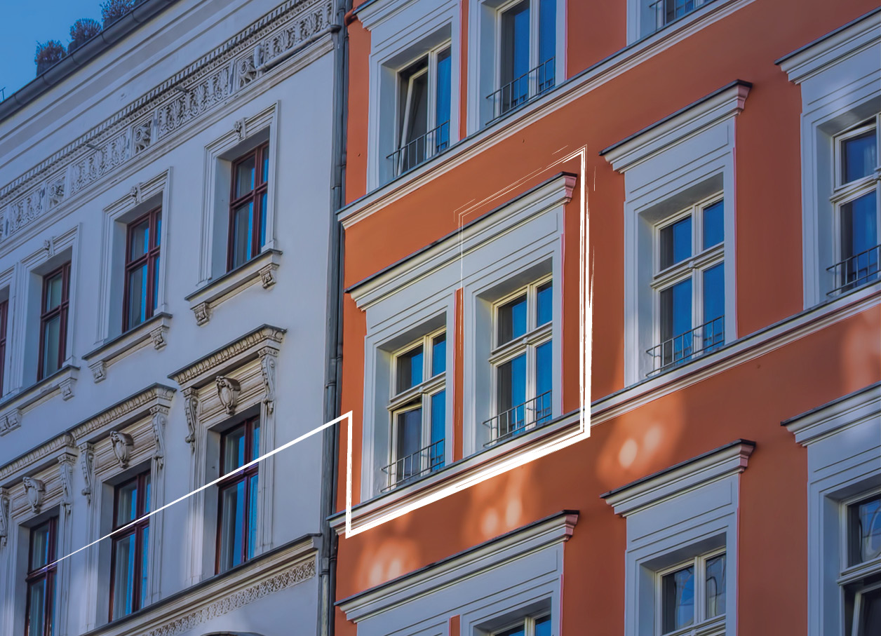 Eine Hausfassade mit Fensterfront